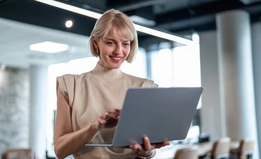 Woman using a tablet while working in a modern office